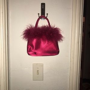 Tiny red purse with feather trim